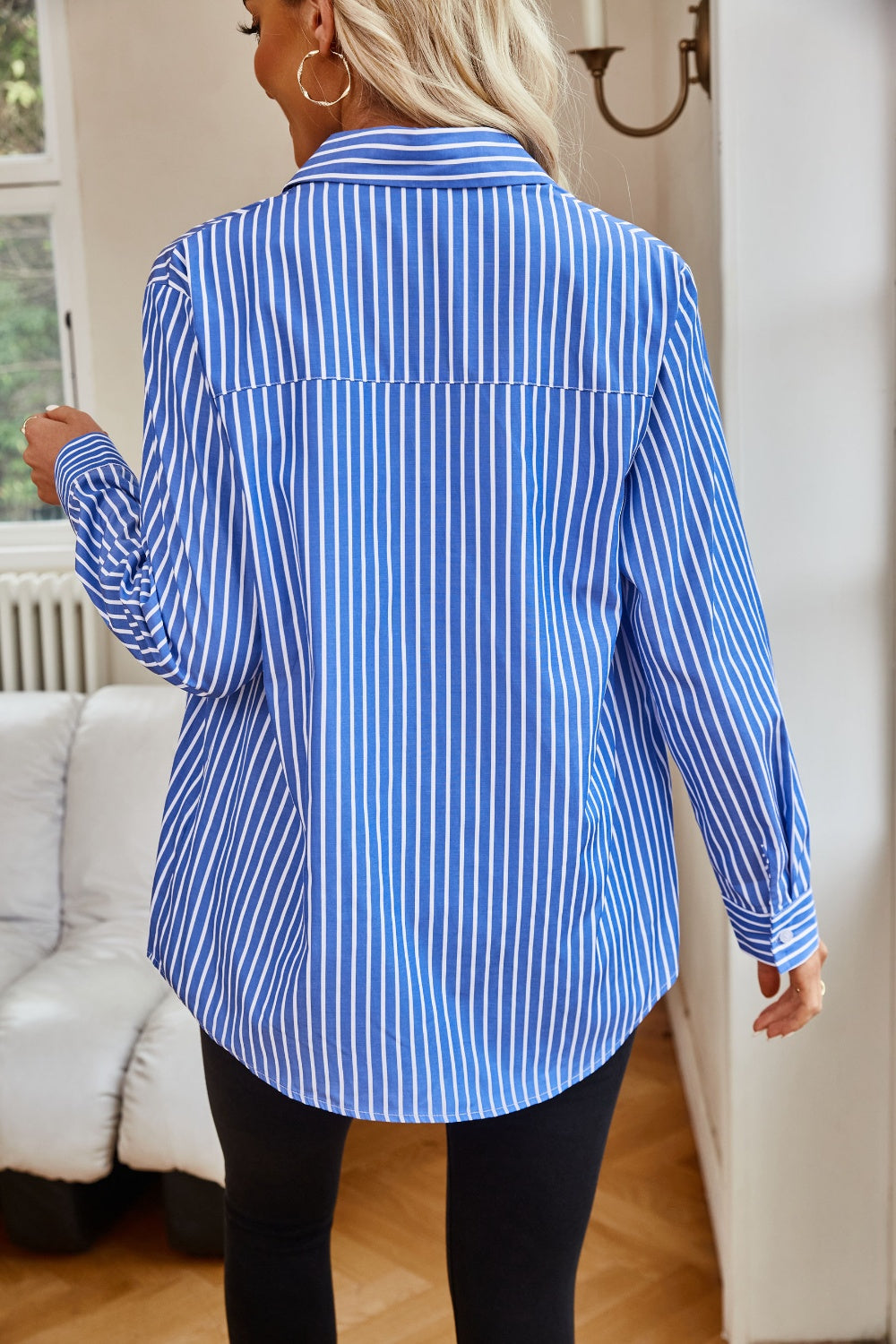 Back of Blue and White Striped Button Up Shirt loosened