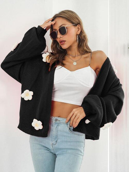 Model with Black 3D Floral knitted cardigan. 