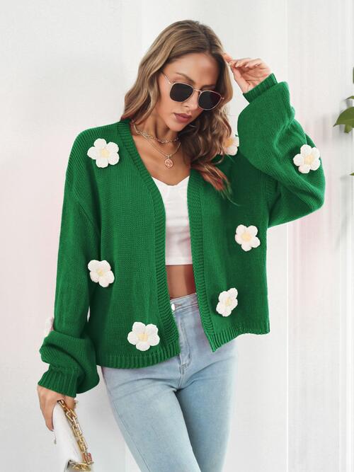 Green knitted Cardigan with white flowers. 