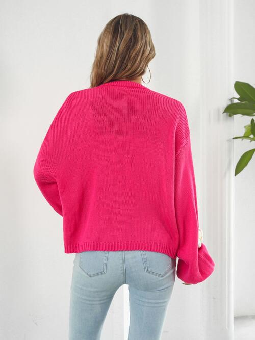 Back of the hot pink 3D Floral cardigan.